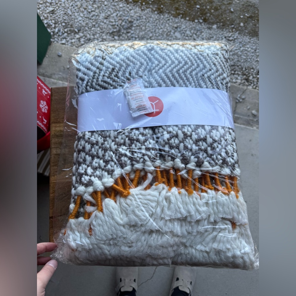 Cozy Knit Blanket in Gray and White with Orange Accents